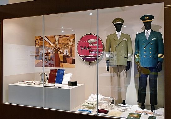The Sleeper Train exhibition includes photographs, illustrations, reproductions, model trains, and original artifacts such as conductor uniforms and engine name plates