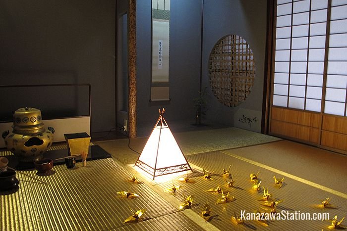 Origami cranes of folded gold leaf decorate the floor of the Golden Tea Room