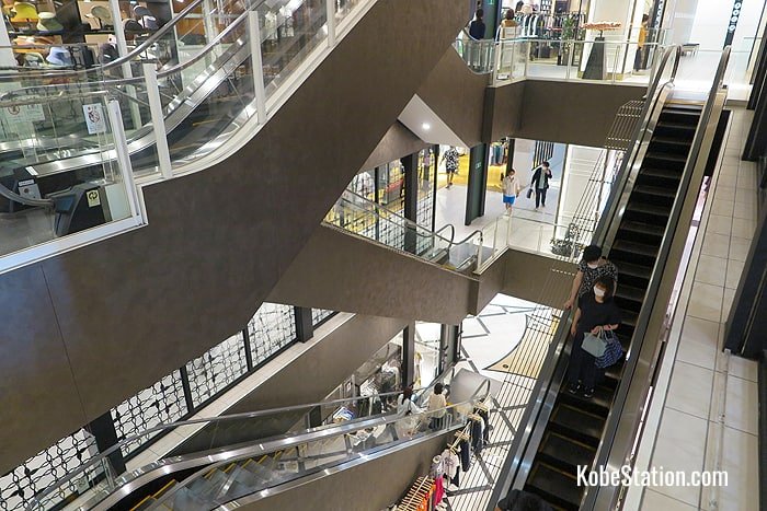 The escalators in Mint Kobe run through an open atrium connecting all the floors