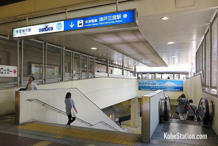 Stairs and an escalator leading down to Hanshin Kobe-Sannomiya Station