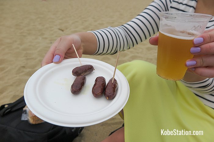 Enjoying some venison sausages and craft beer on Suma beach