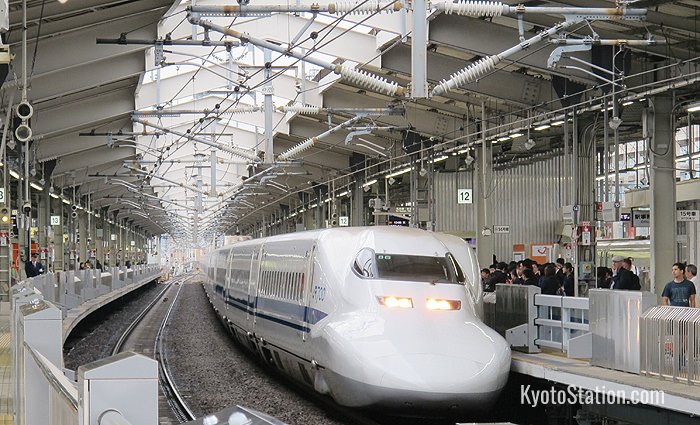 The Nozomi shinkansen bullet train arriving at Kyoto Station