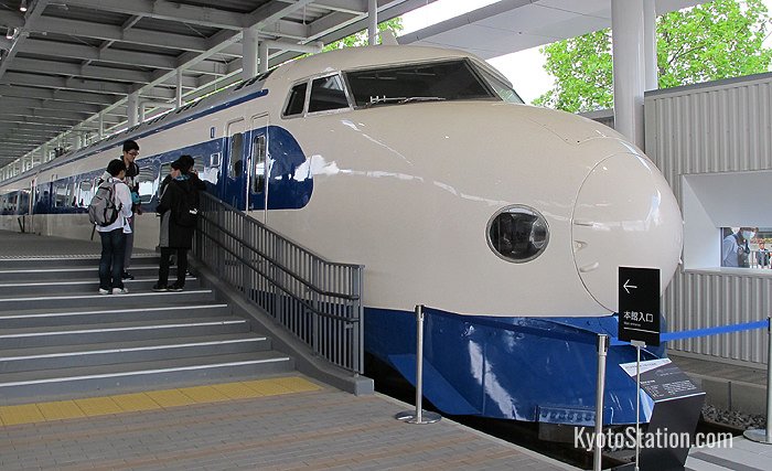 The series 0 shinkansen is on display in the promenade at the entrance to the museum