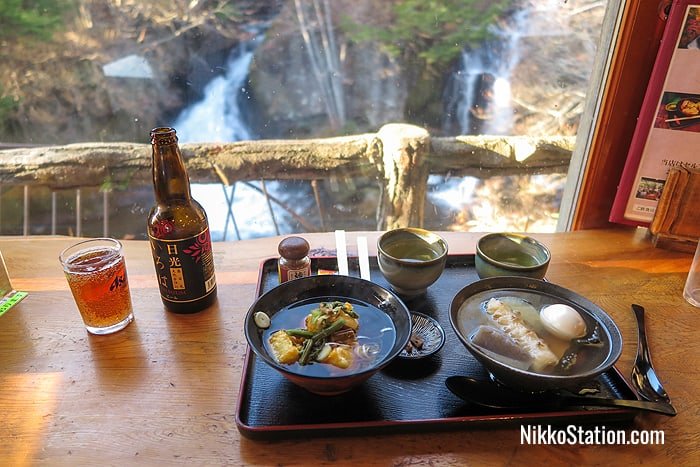 Local Iroha craft beer with a bowl of ozoni on the left and oden on the right (both served with tea)