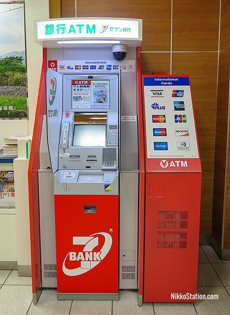 The 7-Bank ATM is beside the ticket gates