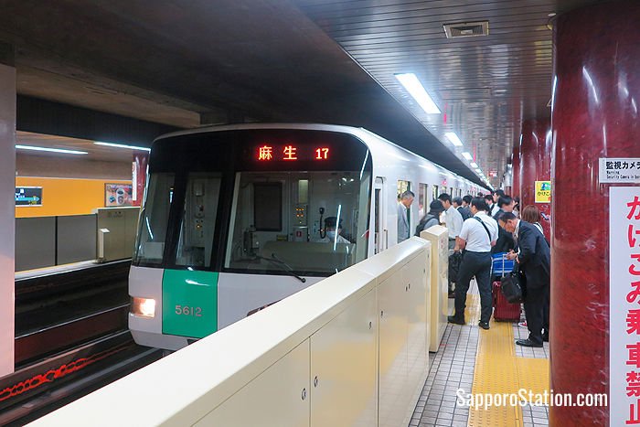 Passengers boarding a train for Asabu