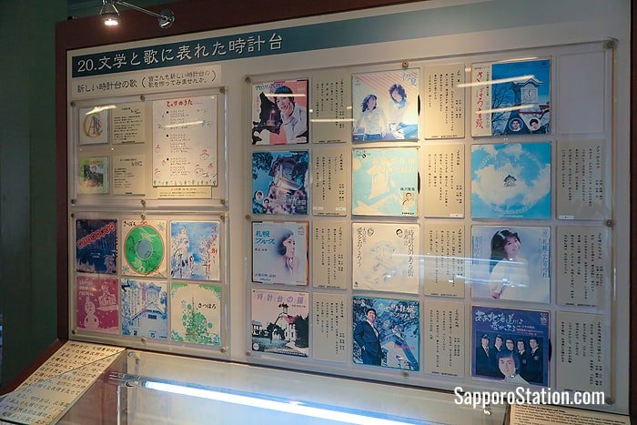 A display inside the Clock Tower museum showing works of literature and song that have celebrated Sapporo Clock Tower