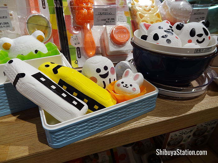 Mock-ups of rice balls in the shape of Shinkansen bullet trains, bunnies and pandas are used to display rice ball molds at Loft Shibuya