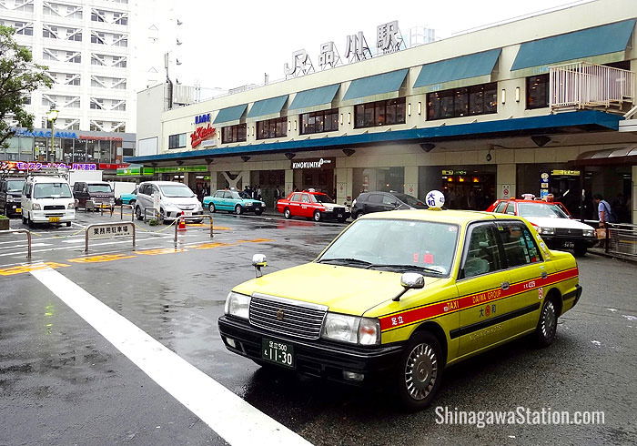 Taxis and a police box can be found on the west or Takanawa side of the station