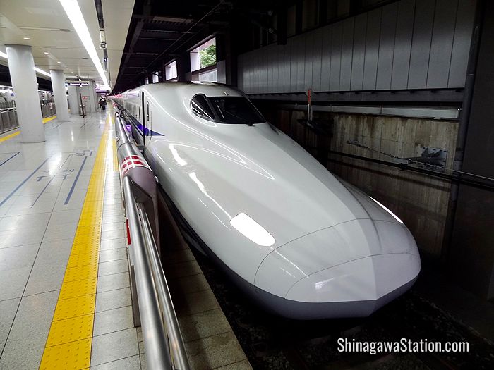 A bullet train bound for Kyoto and Osaka waits at Shinagawa Station