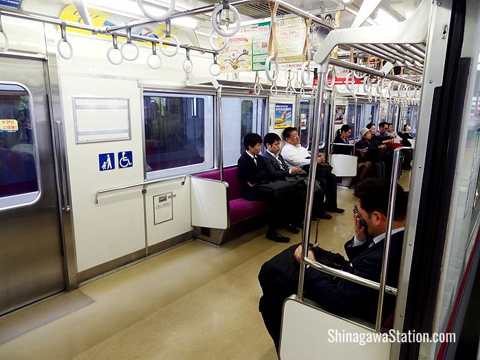 The Keikyu trains have benches and are not as comfortable as the Narita Express