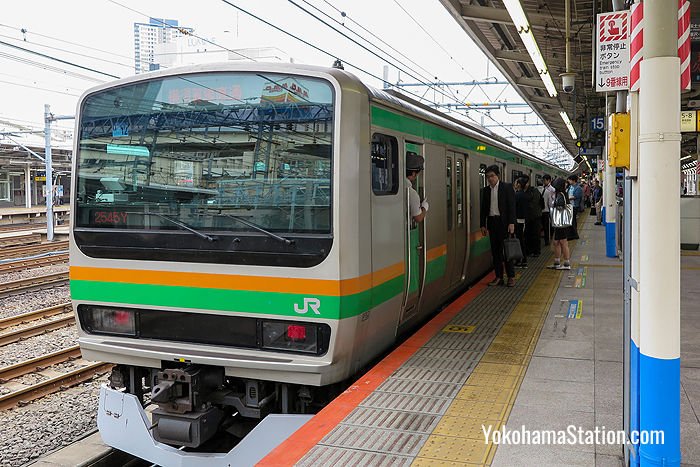 A local through service bound for Zushi at Platform 9, Yokohama Station