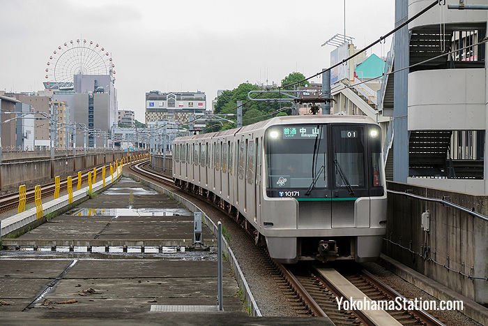 A Green Line train arriving at Center-Minami Station. Some parts of the line are above ground