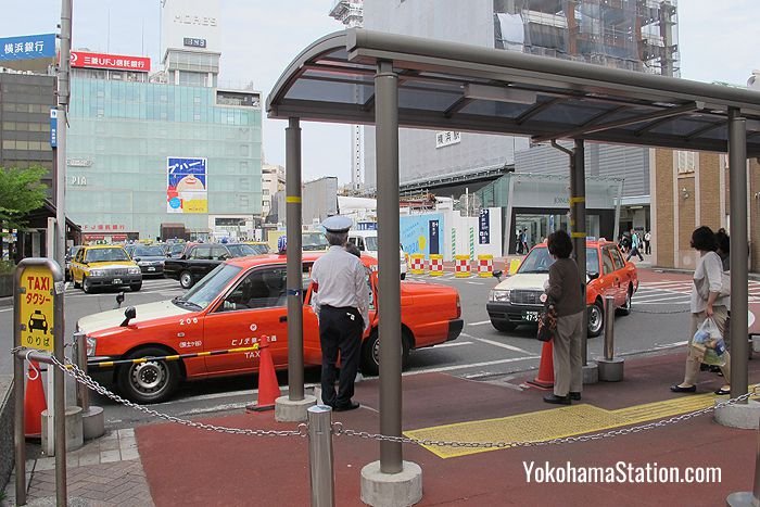 Taxis lining up at the Yokohama Station taxi rank